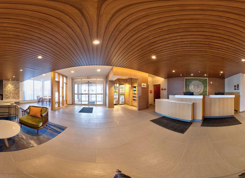 Fairfield by Marriott Inn & Suites Milwaukee Brookfield lobby with curved wood ceiling and front desk