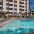 Four Points by Sheraton Los Angeles Westside pool terrace in Culver City with lounge chairs and cabana