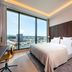 Mövenpick Hotel Basel room with floor-to-ceiling windows and city views in Basel