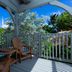 Crane's Beach House Boutique Hotel & Luxury Villas in Delray Beach, tropical porch with chairs and garden view