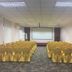 Oriental Hotel Dongguan conference room with rows of gold-covered chairs facing a projection screen