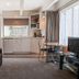 Castles Motel & Driftwood Motel in Nelson: studio suite with kitchenette, sofa, dining table and TV