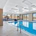 Hampton Inn & Suites Chicago Deer Park indoor pool with large windows and winter views