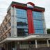 Hotel Sunil Krishna in Tirupati with a glass-front exterior and red central facade