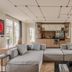 1.75 Paris La Source in Paris: spacious suite with modular sofa and compact kitchenette
