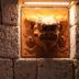 Super Hotel Okinawa Nago carved lion wall art by textured stone entrance