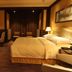 Chateau Star River Beijing guest room in Beijing with king bed, desk, seating area and warm lighting
