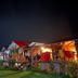Salkantay Hostel Chaullay in Santa Teresa with lit cabins and garden at night