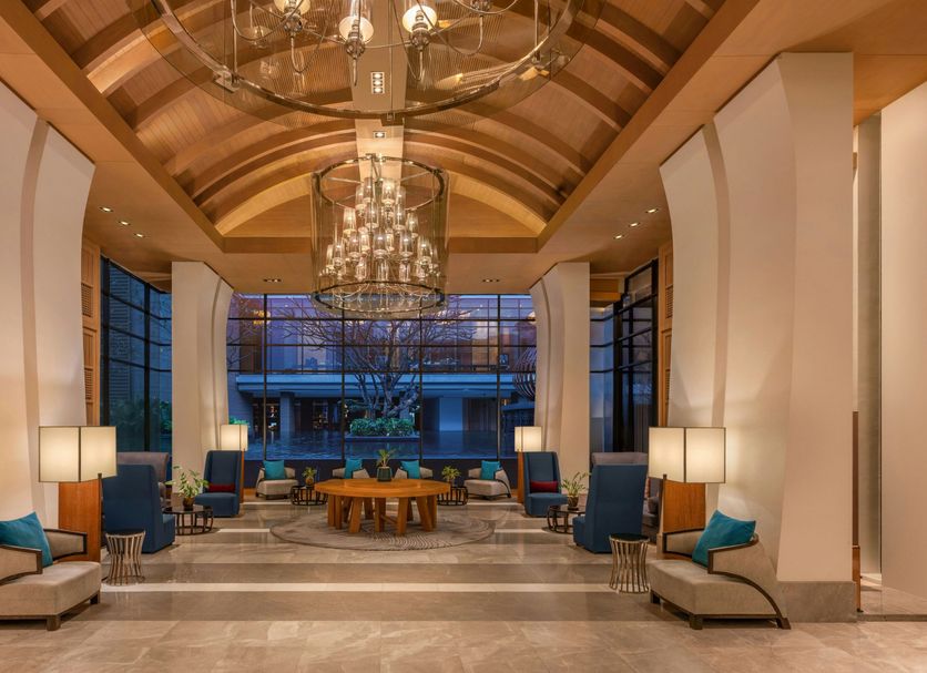 Hilton Bangkok Suvarnabhumi Golf Resort & Spa lobby with chandeliers and seating in Bang Phli