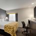 Baymont by Wyndham Branford/New Haven guest room with king bed, desk and chair in Branford