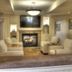 Lodge at Five Oaks Pigeon Forge lobby lounge with fireplace, TV, and cushioned seating