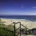La Casa del Camino in Laguna Beach with oceanfront stairs leading to a sandy beach and blue sea