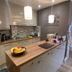 Deepcut Lodge Bed & Breakfast Self Service Camberley self-service kitchen with island, pendant lights and fruit bowl