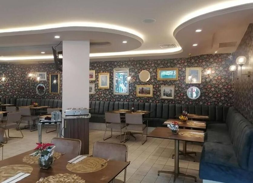 Hotel Century Reforma in Mexico City lounge with patterned walls, curved ceiling lights, and seating area