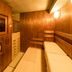 Dormy Inn Premium Kyoto Ekimae Natural Hot Spring in Kyoto sauna room with wooden benches and wall clock