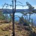 Älgbergets Bed & Breakfast in Stenungsund with lake view from a wooded hillside