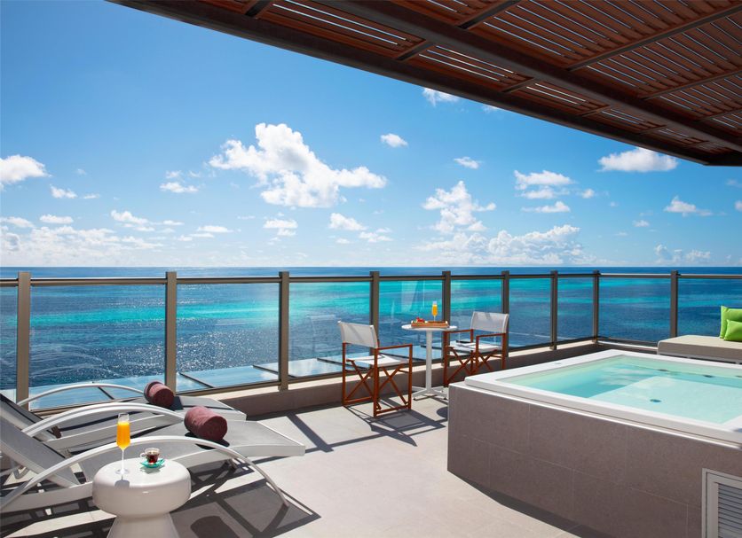 Dreams Natura Resort & Spa in Puerto Morelos: ocean-view rooftop terrace with hot tub and loungers