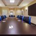 TownePlace Suites by Marriott Tulsa North/Owasso meeting room in Owasso with long conference table and blue chairs