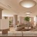 Hotel della Valle in Agrigento lobby with curved sofa seating and warm modern lighting