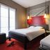 ibis Paris Gare de l'Est TGV in Paris twin guest room with two beds and hanging pendant lights