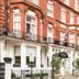 Hotel Indigo London - Kensington by IHG exterior on a red-brick London street