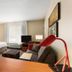 TownePlace Suites by Marriott Salt Lake City Layton room with bed, sofa, desk and window seat