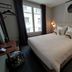 Hôtel Paulette Rouen Centre Cathédrale room with double bed, desk, window and bedside lamps in Rouen