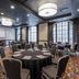 Hotel Indigo Nashville - The Countrypolitan By IHG meeting room with round banquet tables and projector screen