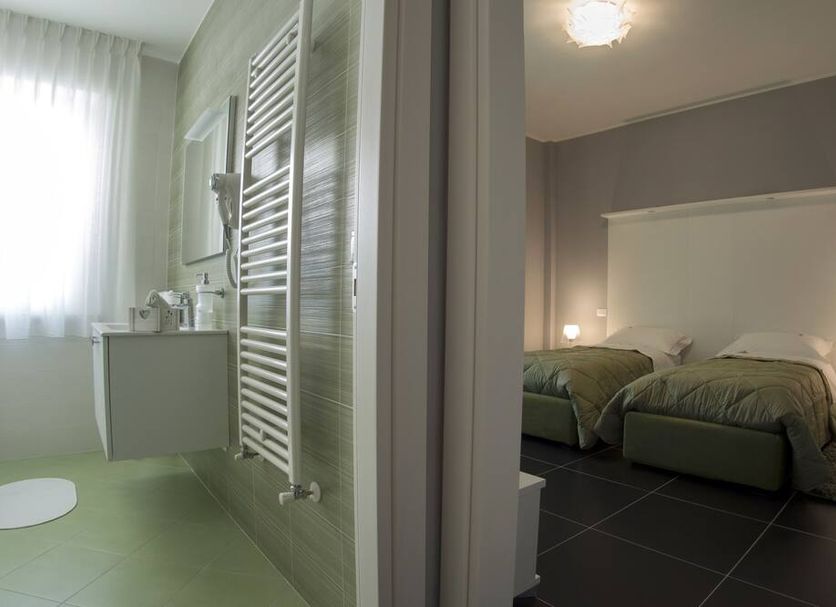 B&b Langolino in Montesilvano, guest room with twin beds and adjoining bathroom