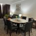 Hotel Seri Malaysia Genting Highlands dining area with round table, chairs, sofa and curtained window