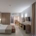 Electra Holiday Village Water Park Resort in Ayia Napa, guest room with twin beds, desk, and wall-mounted TV