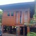 Wood House Pattaya in Pattaya, wooden elevated bungalow with balcony and stairs