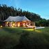 Koyao Island Resort in Ko Yao Noi, luxury tented villa with lawn and outdoor lounge at dusk