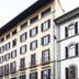 Soggiorno Burchi in Florence, street view of a historic multi-story hotel facade with balconies and shuttered windows