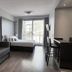 CH Recoleta Suites in Buenos Aires: suite with sofa, bed, desk and balcony door