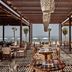 The Royal Senses Resort & Spa Crete, Curio Collection by Hilton beachfront dining terrace in Panormos