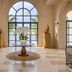 Centara Mirage Resort Mui Ne lobby with arched window and ocean view in Phan Thiet