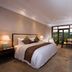 New Century Hotel Guian Guizhou room in Anshun with king bed and balcony view