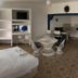 Hotel Paraiso Kora in San Blas guest room with two beds, table seating, and kitchenette area