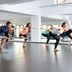 Caro Horoscop Hotel Bucharest fitness studio with guests doing yoga poses