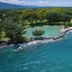 Sanghyang Indah Spa resort in Anyar with a lagoon beside a turquoise coastline and lush trees