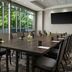 The Westin Reston Heights meeting room with conference table, chairs, and large windows overlooking trees