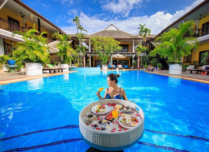 Vdara Pool Resort Spa Chiang Mai in Chiang Mai with a large outdoor pool and floating breakfast tray