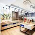 Hampton by Hilton Oswiecim breakfast buffet area with serving stations and wooden tables in Oświęcim