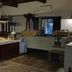 Agriturismo Baglio Vecchio in Castelvetrano dining room with rustic tables and buffet counter