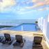 Hotel Plaza Sol Veracruz rooftop infinity pool with ocean view in Boca del Río and lounge chairs
