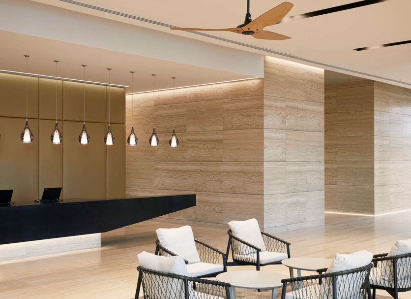 Hyatt Place Melbourne Essendon Fields lobby with reception desk, lounge seating and modern lighting in Essendon North