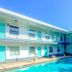Uptown Inn & Suites in St. Petersburg with outdoor pool and two-story motel courtyard