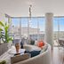 Placemakr Premier Sobro in Nashville living area with floor-to-ceiling windows and city views