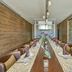 Hideaway at Royalton Punta Cana dining room with long table and wine storage in Punta Cana
